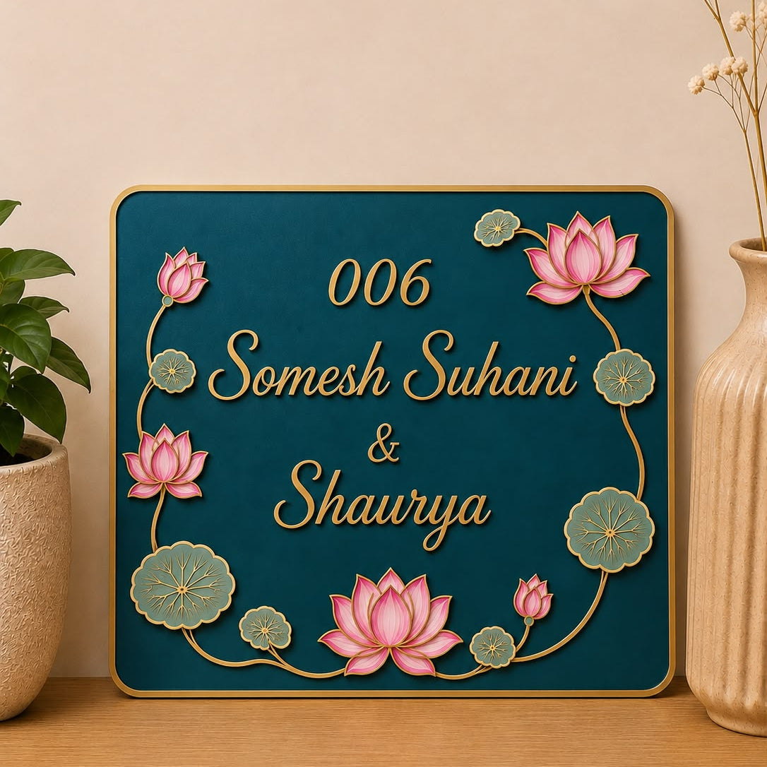 A personalized rectangular plaque with a dark teal background, gold border, and raised pink lotus flowers with green leaves.