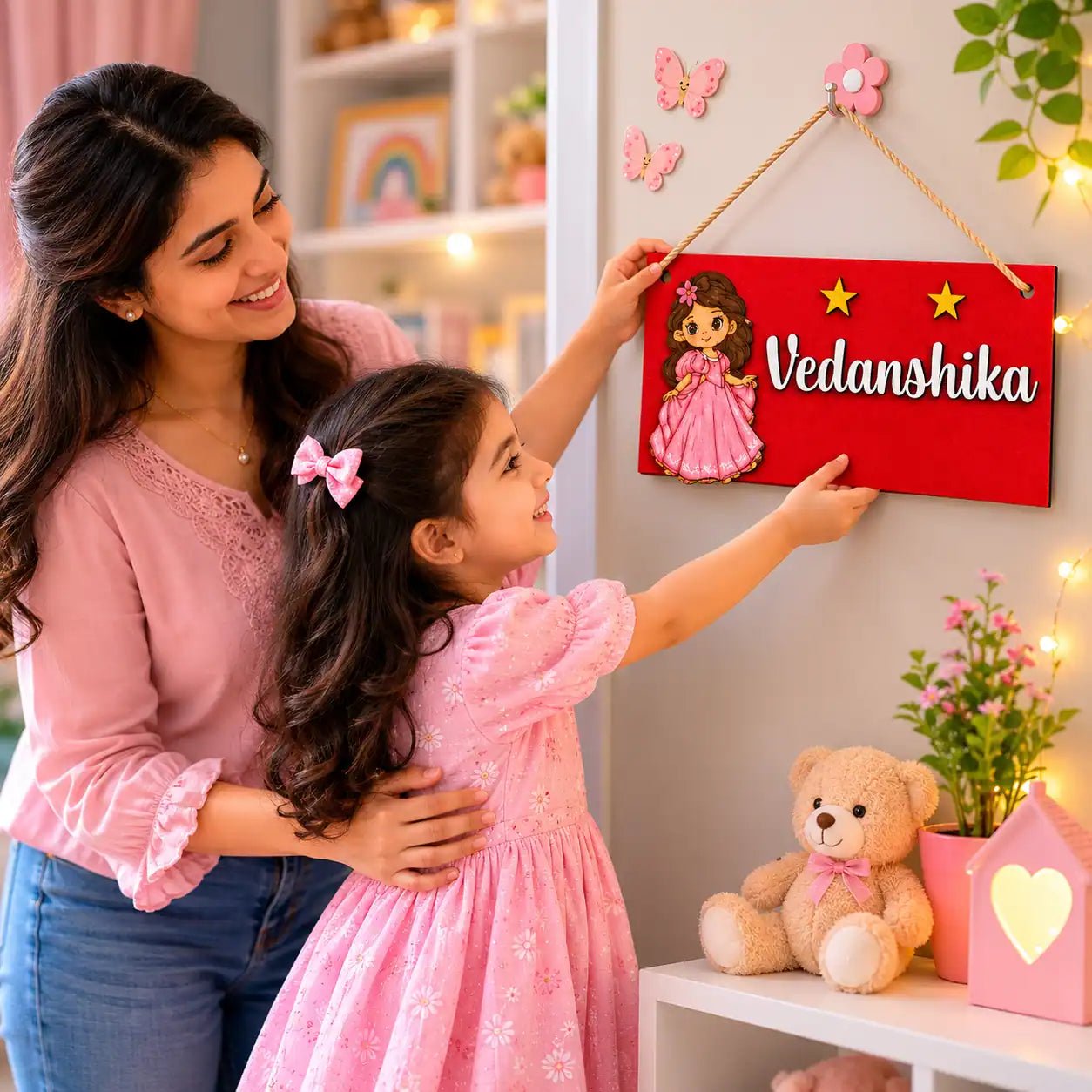 Woman and child in a room with decorative nameplate and teddy bear