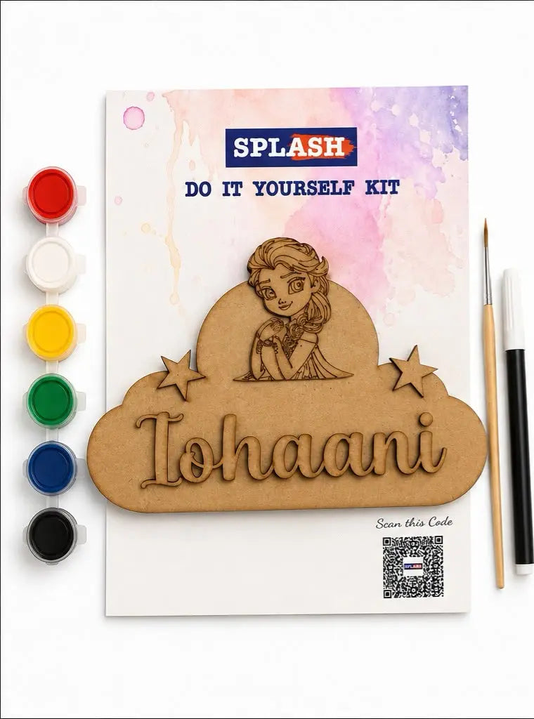 A DIY craft kit labeled SPLASH DO IT YOURSELF KIT, featuring a laser-cut wooden name plaque with a princess illustration and the name 'Iohaani,' shown with paint pots, a paintbrush, and a printed card on a white background.