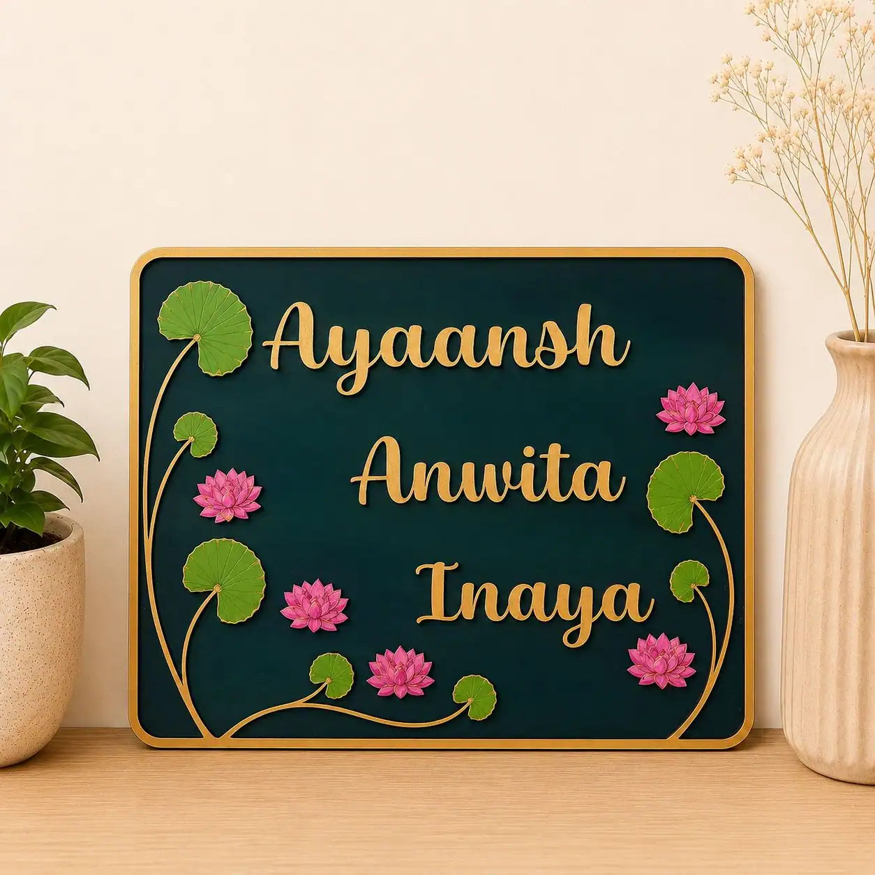 Decorative nameplate with floral designs on a wooden surface