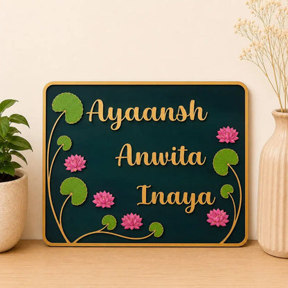 Decorative nameplate with floral designs on a wooden surface