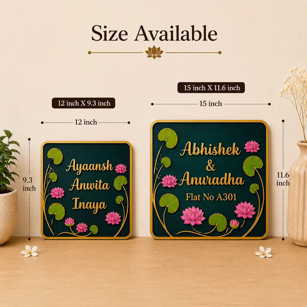 Two decorative nameplates with floral designs and measurements on a wooden surface.