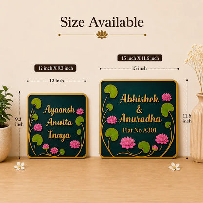 Two decorative nameplates with floral designs and measurements on a wooden surface.
