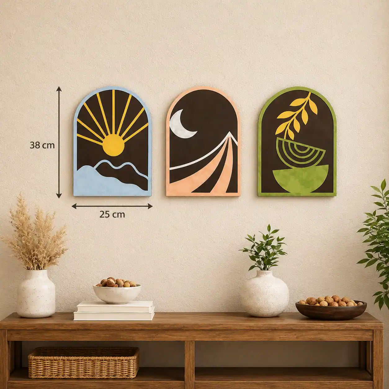 Three decorative wall art pieces on a wall above a wooden shelf with plants and bowls.