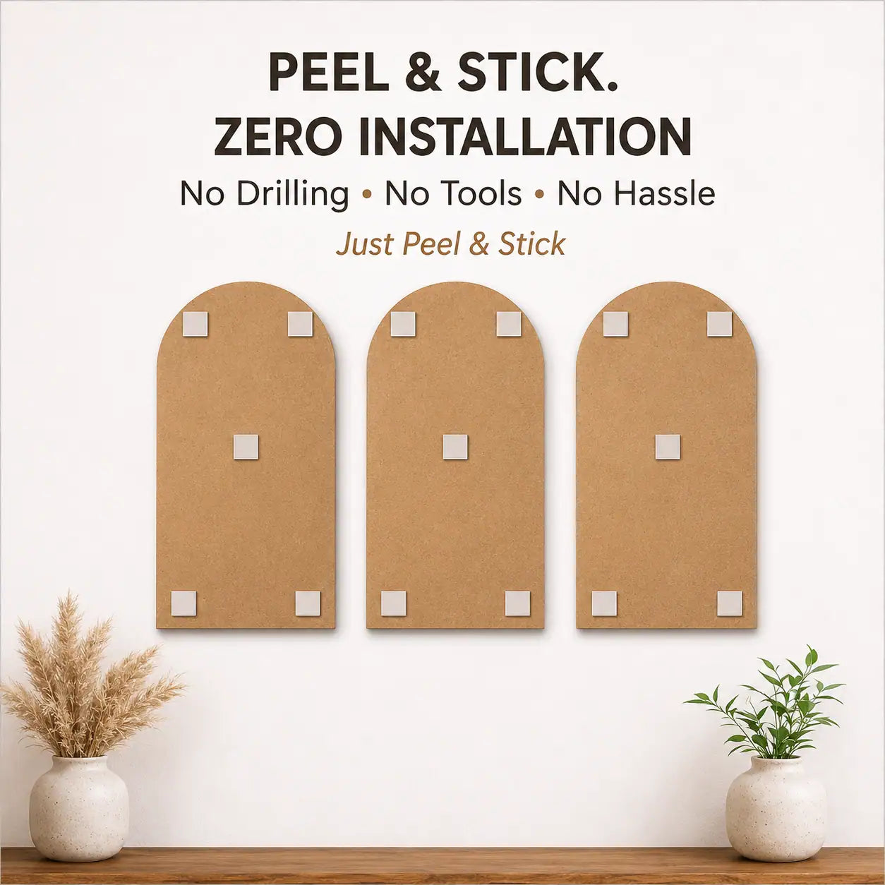 Three peel-and-stick cork boards on a wall with decorative plants below.