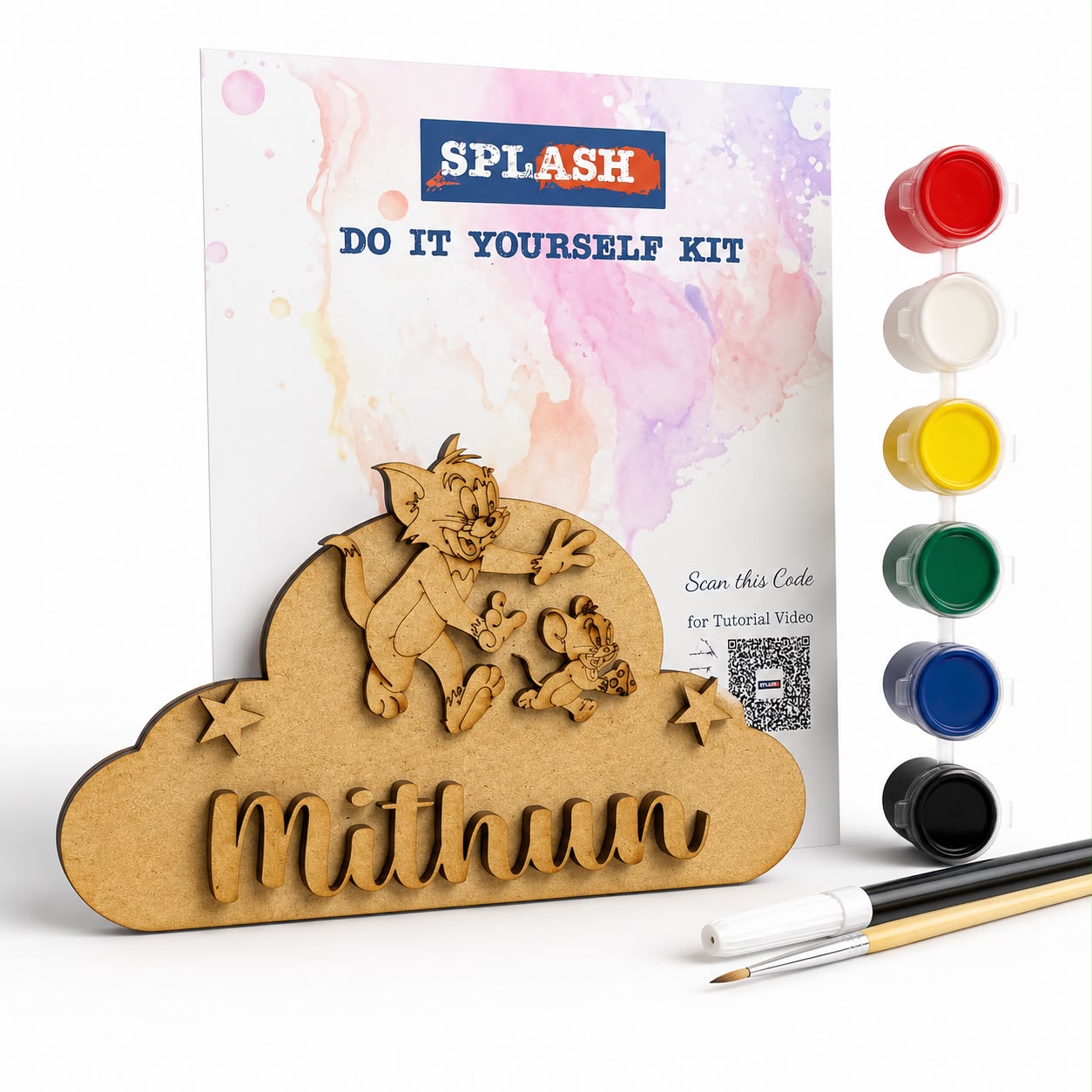 A DIY paint-by-numbers style craft kit shown with a wooden cloud-shaped plaque featuring cartoon characters and the name 'Mithun,' a printed instruction card, six paint pots in red, white, yellow, green, blue, and black, and two small paintbrushes on a white background.